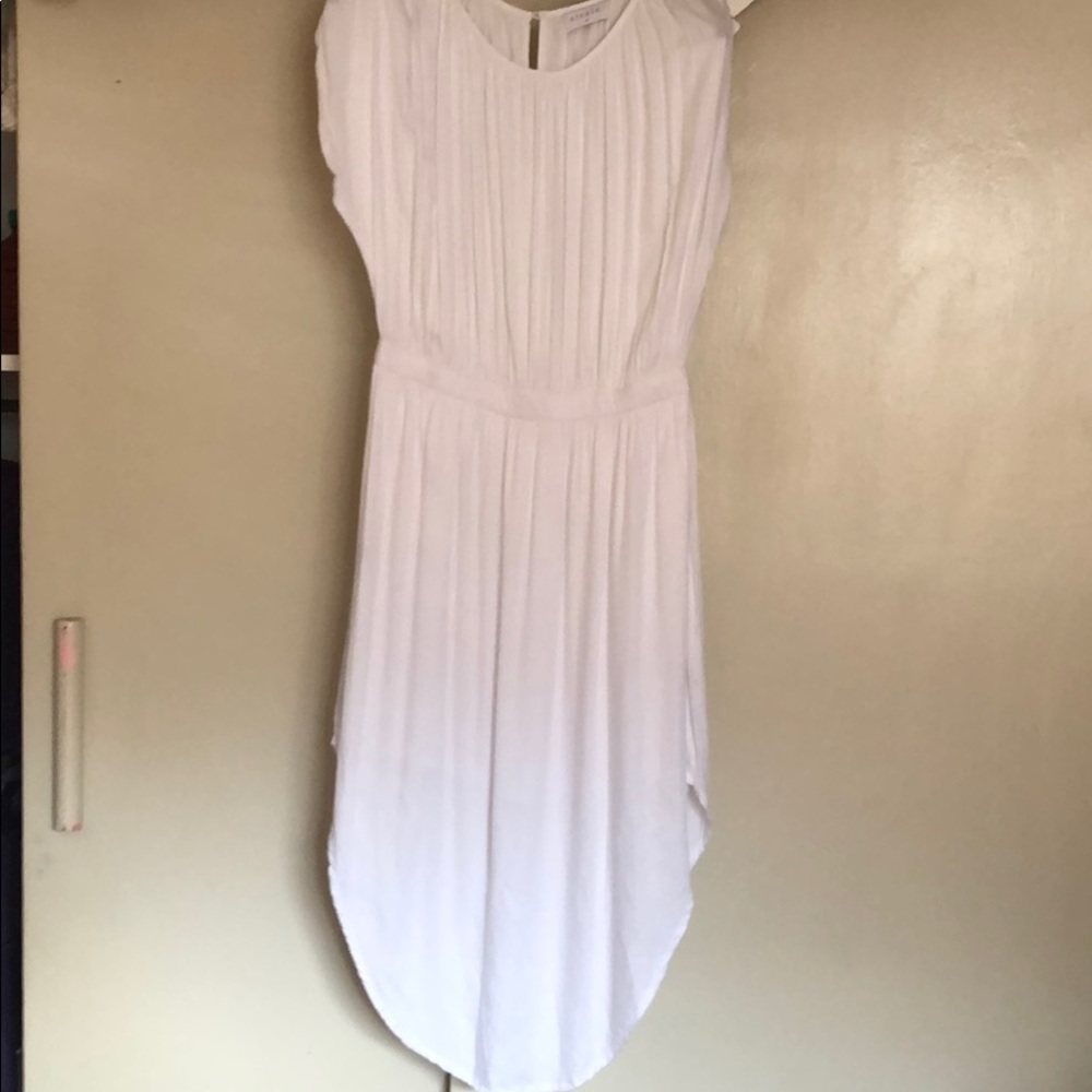 Lightweight, flowy white dress.